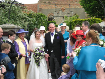 Ceri and Paul outside the church