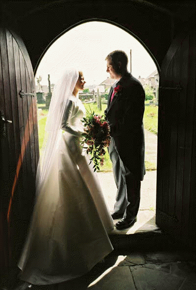 sarah and gareth in church arch