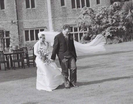 sarah and gareth walking across lawn